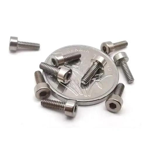 Premium TC4 Titanium Cup Head Hex Socket Machine Screws M1.6 Metric Fasteners 5 Pack on a coin for size comparison.