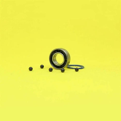 Smooth Hybrid Ceramic Bearings For Your Motor Spindle, Featuring Ultra Low Friction Abec 1 Grade Si3N4 Balls In 8 * 16 * 5 Size on yellow background.