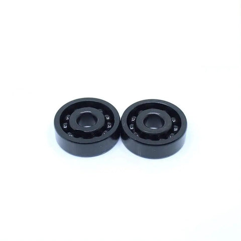 Industrial Grade TB6302 High Temperature Full Ball Bearing Built Tough For Extreme Engines Handling Serious Heat Up To Five Hundred Degrees Celsius With A Rock Solid 15X42X13 mm Profile And Smooth Rotation, two black bearings.