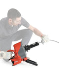 Heavy Duty Cordless Drain Snake With Brushless Motor And Twenty Five Foot Steel Cable Blasts Away Stubborn Clogs in use.