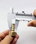 Close-up of a person measuring a brass fitting for the Top Notch DC 12V Solar Hot Water Heater Circulation Pump.