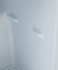 Interior view of Hella Quiet 1.1 Cu Ft Countertop Upright Mini Freezer In Snazzy Steel White with removable shelves.
