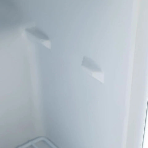 Interior view of Hella Quiet 1.1 Cu Ft Countertop Upright Mini Freezer In Snazzy Steel White with removable shelves.