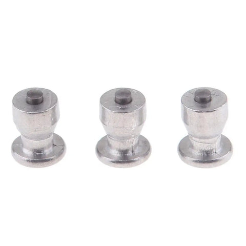 Close-up of removable tungsten carbide ice grip screws for hardcore tire spikes for cars and trucks winter snow chain replacement.