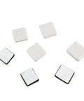 Heavy Duty 12 Pack Furniture Sliders For Carpet And Hardwood Floors with reusable white foam pads, each 1.5 inches square.