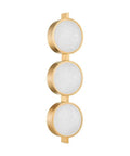 Modern Three Light Wall Sconce Sporting Vintage Brass Finish And Seeded Glass Shade Damp Rated For Bathrooms. 21.75 inch tall.
