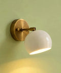 Modern Brass Wall Sconce Light Fixture, Hardwired Wall Lamp in compact size with white shade mounted on green wall.