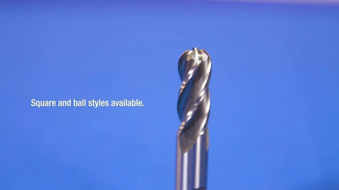 Close-up of an HSS 2-flute end mill with twisted cutting edges against a blue background