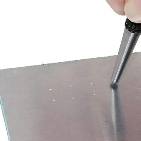 Sick 3 Piece Center Punch Kit Forged From High Carbon Steel With A Hella Secure Non Slip Grip creating a starter hole in metal.