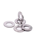 Close-up of five 1/4-inch stainless steel flat washers with bright finish (0.28" ID, 0.63" OD)