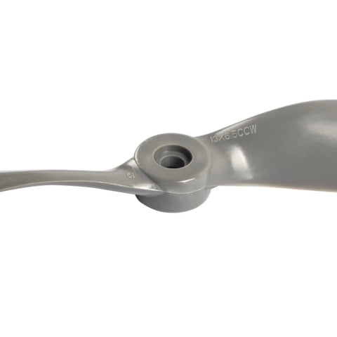 Close-up of gray 13x6.5 CCW 2 Vane Direct Drive Nylon RC Propeller, part of a set with adapter rings for airplanes drones gliders.