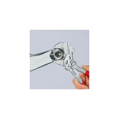 Adjustable Pliers Wrench For Handy Home Repairs And Pro Jobs With Smooth Jaw Action gripping metal nut.