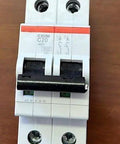 One Piece Heavy Duty Two Pole Miniature Circuit Breaker 20 Amps with black switch and white casing for electrical safety.
