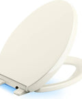 Reveal Nightlight Quiet Close Toilet Seat with Grip Tight Fit for Elongated Toilets Biscuit Color Featuring LED Lighting