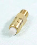 Close-up of brass thermal release relief valve for pressure washer; brass body with threaded ends.