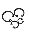 Grab A Sweet Deal On These Heavy Duty M6 To M150 Hole C Circlips Made From Tough 65 Manganese Steel For Your Next DIY Project And Home Repair Job With A Black Finish That Keeps Things Snapped Tight - Various sizes and shapes of black circlips.