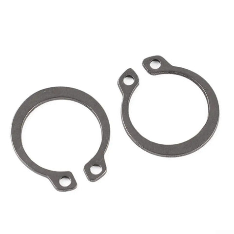 Super Solid 100 Pc 304 Stainless Steel External Retaining Ring Set Circlips shown in two sizes with holes for securing bearings.