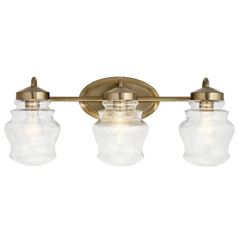Janiel 24 Inch Three Light Vanity Light with clear glass shades in classic bronze finish, ideal for above the mirror installation.