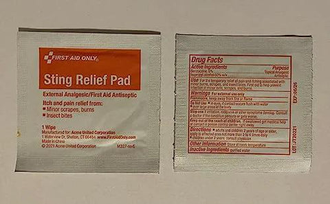 Two First Aid Only Sting Relief Pad packets with orange label, front view.