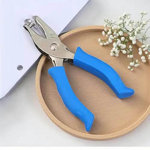 Blue One Circle Hole Punch With Soft Grip Handheld Paper Punch for crafts on wooden tray