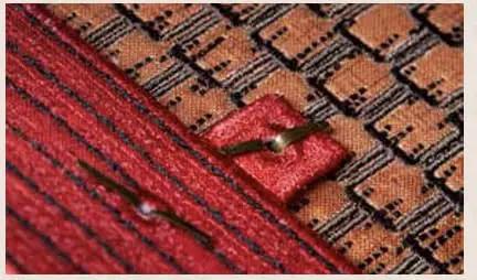 Miniature Structure Brads 100 Piece Set Durable Metal Fasteners on fabric with red and brown patterns for crafting and DIY projects.