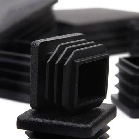 Close-up of 100 Pack 1 Inch Square Plastic Tube End Plugs For 1 Inch Outside Diameter Square Tubing, durable black chair glide caps