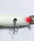 Side view of glowing 4.5 inch wood lure with stainless diving lip, minnow plug basewood basswood build for saltwater action, 1.76 oz.