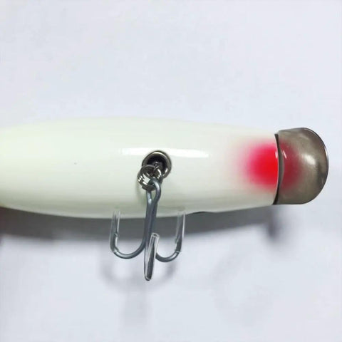 Side view of glowing 4.5 inch wood lure with stainless diving lip, minnow plug basewood basswood build for saltwater action, 1.76 oz.