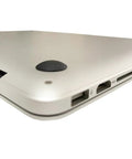 Side view of laptop with installed self adhesive rubber feet pads replacement bottom feet for laptops MacBook Pro MacBook Air and more