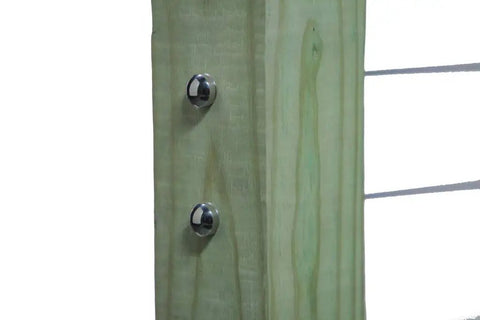 Self Locking Swageless Quick Connector for One Eighth Inch Cable Railings on wood post with Brushed Stainless Dome Caps visible