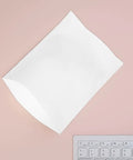 White EPE foam bag from 100 Count White EPE Foam Packing Bags For Shipping And Moving Thick Tear Resistant Cushion Pouches on pink surface