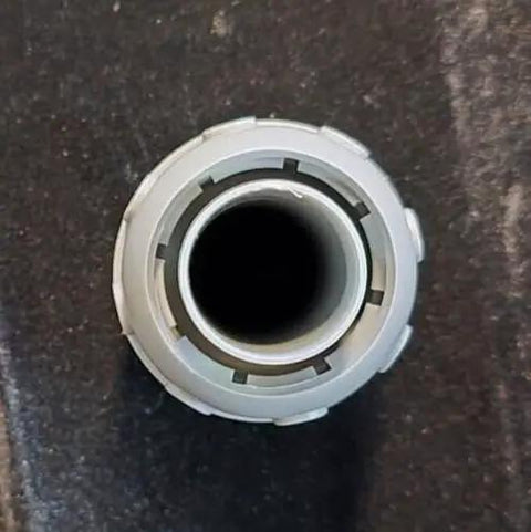 Solid Grip Eight Piece 1 Inch PVC Liquidtight Straight Conduit Fittings For Flexible Electrical Wiring With Steel Locknuts And Tight Seal Gaskets Zero Fuss Setup For Every Tradesman Crew close-up view of PVC conduit fitting opening.