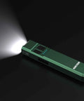 Tracer 1000 Lumens Ultra Slim EDC Flashlight Forest Green Blue Beat The Dark With A Pocket Friendly 4.4 X 1.0 X 0.5 Inch Frame And 2.8 Oz Weight Multi Mode Beam For Everyday Carry Camping Hiking And Late Night Jobs shown on black background, emitting bright light.