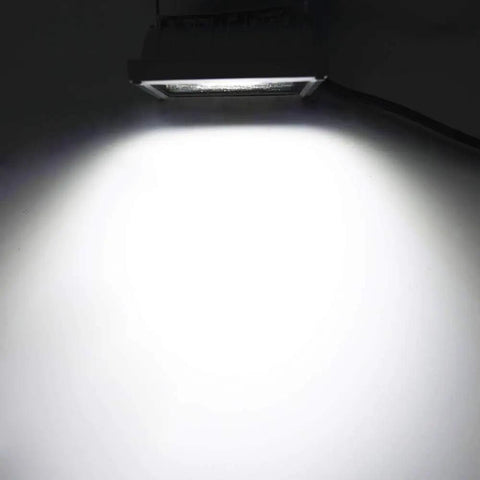 50W Warm White LED Flood Light Kit 12V DC To 60V Low Voltage Security Light illuminating a white wall, showcasing the bright output.