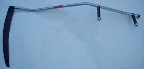 Curved Metal Scythe Blade And Snath With A 53 Inch Handle 22 And A Half Inch Long Blade By 2 And A Quarter Inch Wide Reinforced Spine Made In USA Handcrafted For Light Brush Clearing Grass And Grain Work displayed on a flat surface.