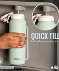 Pop And Fill 22oz Stainless Steel Water Bottle With Quick Fill Lid shown being filled in pistachio color
