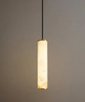 Omgomne Natural Spanish Alabaster Pendant Light 11.8 inch hanging with soft glow, showcasing brass top and unique alabaster texture.