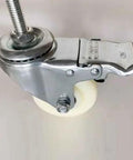Heavy Duty M14 Swivel Casters With Slam Lock Brakes Pack Of 4 Built Like A Tank 4 Inch Nylon Wheels close-up view of caster with brake mechanism.