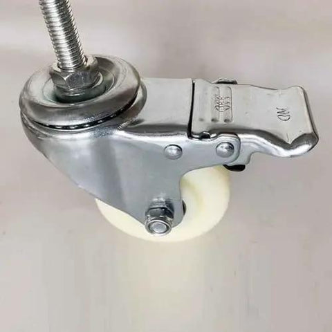 Heavy Duty M14 Swivel Casters With Slam Lock Brakes Pack Of 4 Built Like A Tank 4 Inch Nylon Wheels close-up view of caster with brake mechanism.