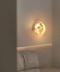 ROPCVAX Wall Sconce Lamp Light Fixture Lighting Modern Nordic, 5.9" alabaster round sconce illuminating a modern interior.