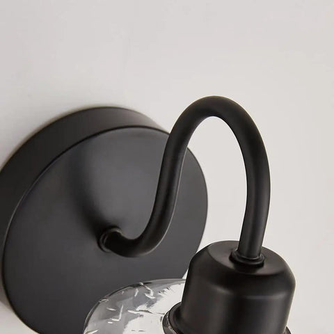 Close-up of Set Of 2 Black Farmhouse Vanity Wall Lights With Seeded Glass Shades Sleek Modern Metal Sconce Fixtures E26 Base