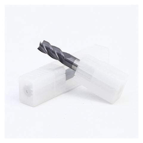 Front view of a 4-flute carbide end mill with a dark coating, placed in a white plastic storage case.