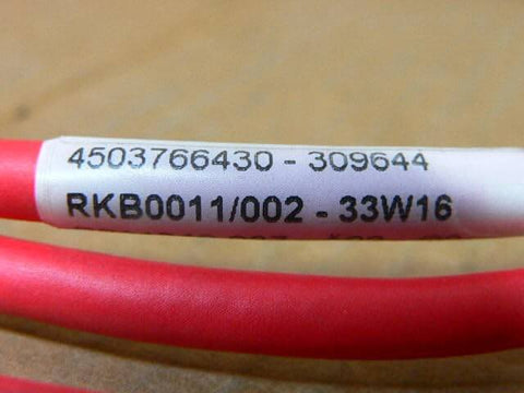 Replacement R911342087 Rkb0011/002 Shielded Lead 1-Pack close-up showing part number on red cable