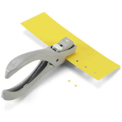 Heavy Duty One Eighth Inch Circle Craft Punch for cardstock, chipboard and lightweight metal with locking handle on yellow paper