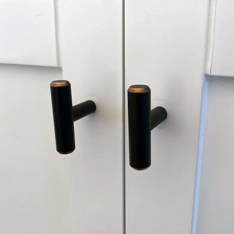 Solid Stainless Steel Euro Style Bar Cabinet Pulls 25 Pack One And Three Quarter Inch Length Oil Rubbed Bronze Finish on white cabinet