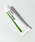 Pure Goop waterjet lubricant tube; white plastic tube with green stripe, front view.