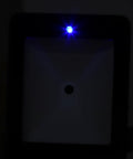 Close-up of Hands Free 2D Barcode Scanner With Omnidirectional 360 Degree Reading USB showing illuminated sensor light.