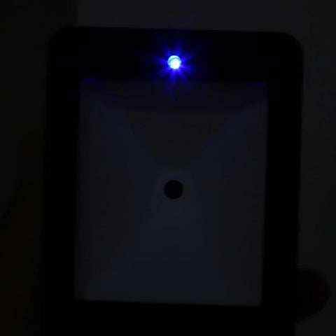 Close-up of Hands Free 2D Barcode Scanner With Omnidirectional 360 Degree Reading USB showing illuminated sensor light.