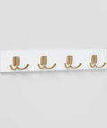 Swoop Up Fresh Wall Mounted Coat And Hat Rack Featuring Four Sleek Gold Dual Hooks On A Crisp White Base Modern Decorative Entryway Storage That Is Seriously A Game Changer, showcasing four gold hooks on a white base.