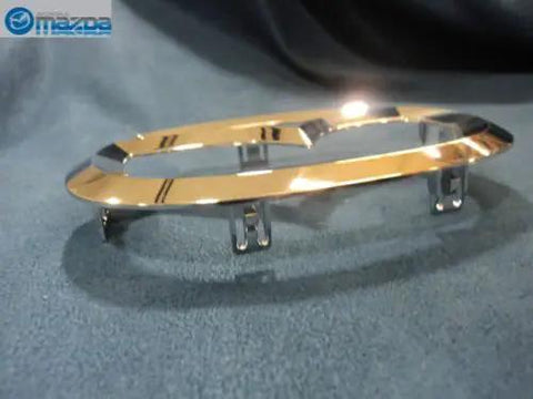 Mazda Front Logo Emblem C235 51 731A Replacement For 2006 2013 Mazda2 Mazda3 Mazda5 And Mazda6, chrome finish, side view